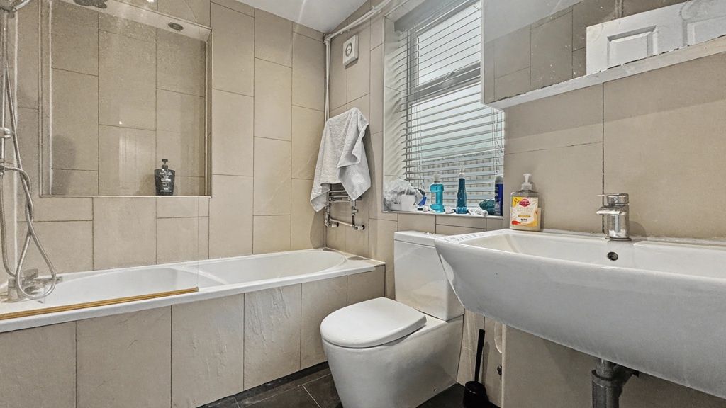Property photo 2 of 12 Bright, Modern Bathroom With A Built-In Bath, Cont...