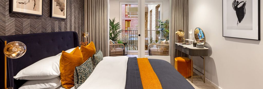 Property photo 2 of 3 Double Bed With Modern Black And Orange Design Décor, Balcony Doors And Vanity Table.