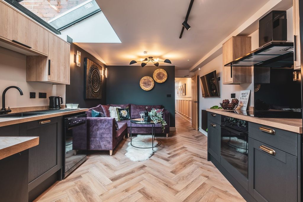 Property photo 3 of 9 Stylish Open-Plan Living Area With A Modern Kitche...