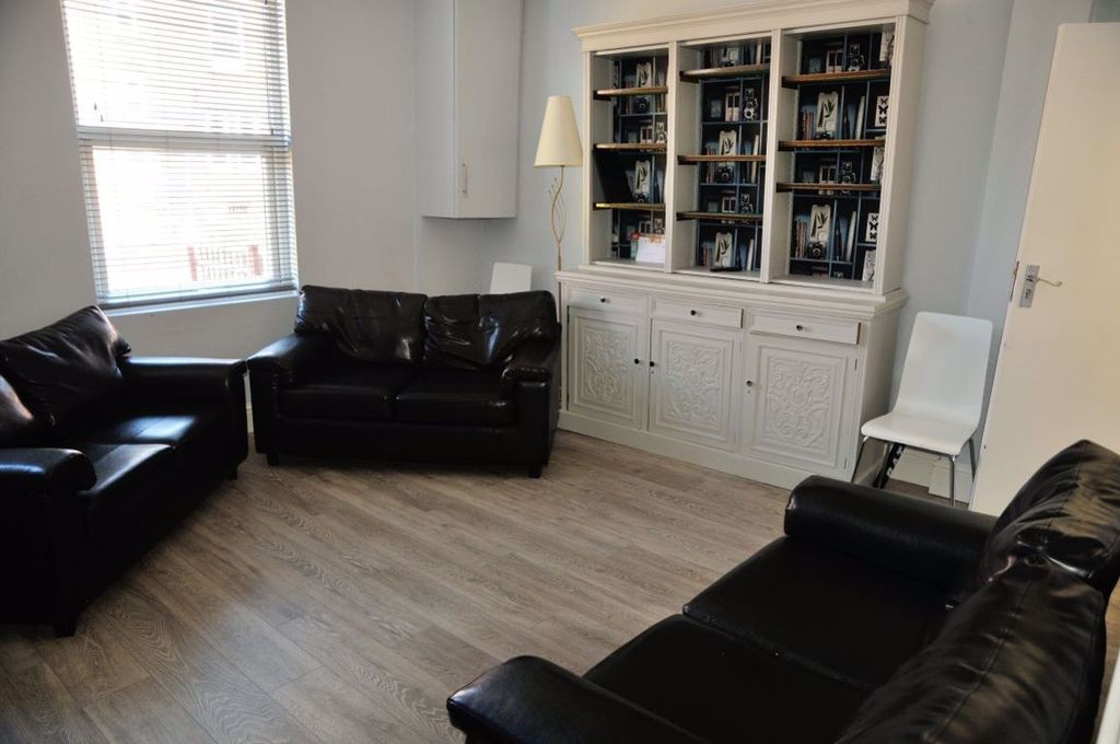 Property photo 2 of 19 A Spacious And Modern Living Room With Large Windo...