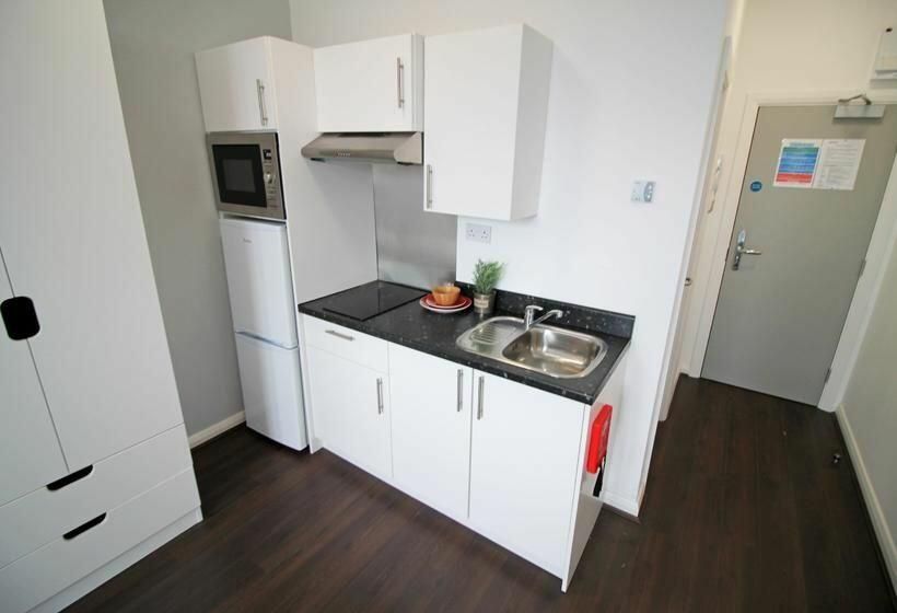 Property photo 3 of 3 Bright, Modern Kitchen Area With Clean White Cabin...