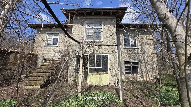 Property photo 1 of 57 View Of The Two-Storey House With External Stairs And Multiple Windows, Surrounded By Leafless Trees.