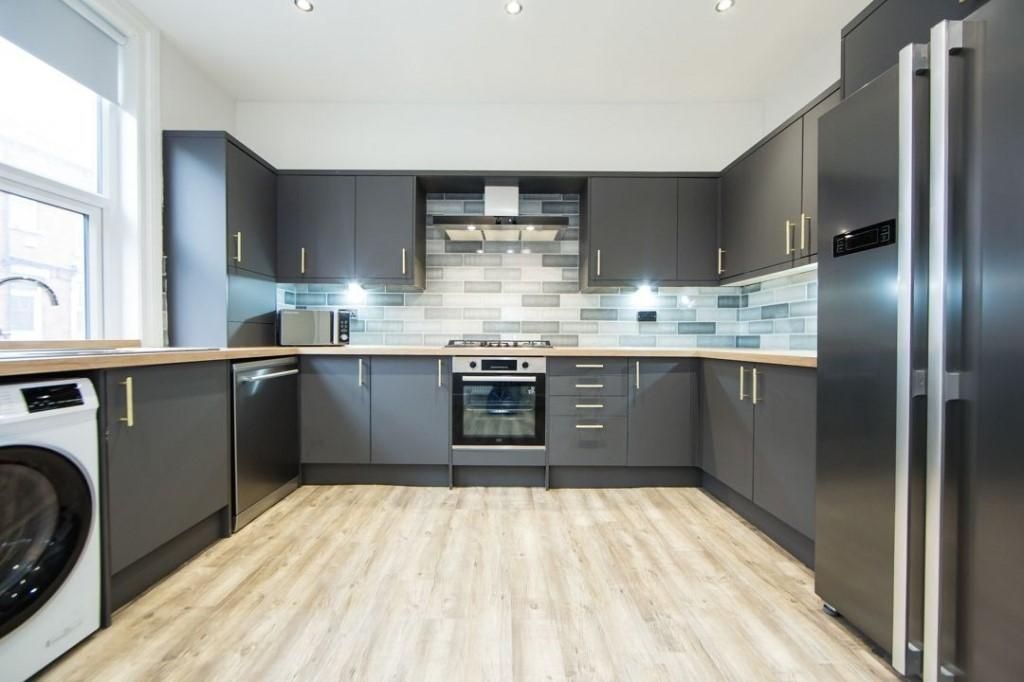 Property photo 1 of 10 Contemporary Fitted Kitchen With Sleek Grey Cabine...