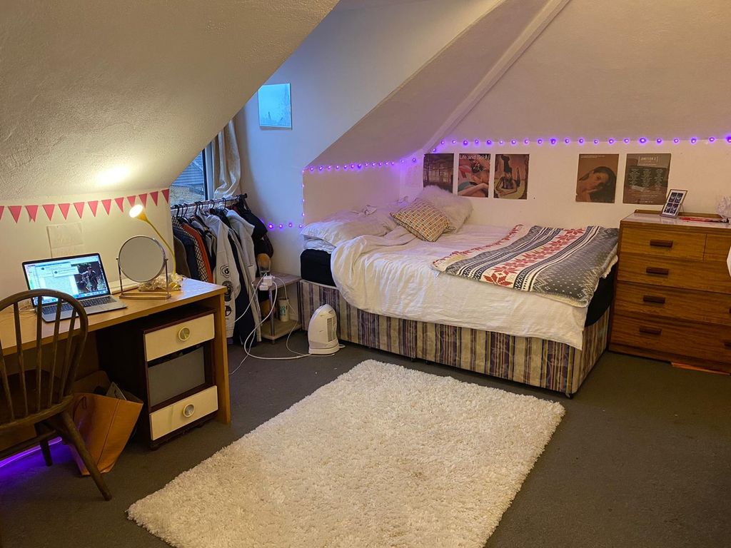 Property photo 3 of 4 A Cozy Bedroom With Ample Space For Relaxation And...