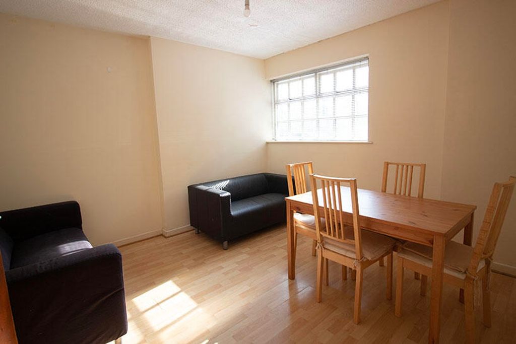 Property photo 3 of 5 Bright And Inviting Living Room Featuring A Cozy S...