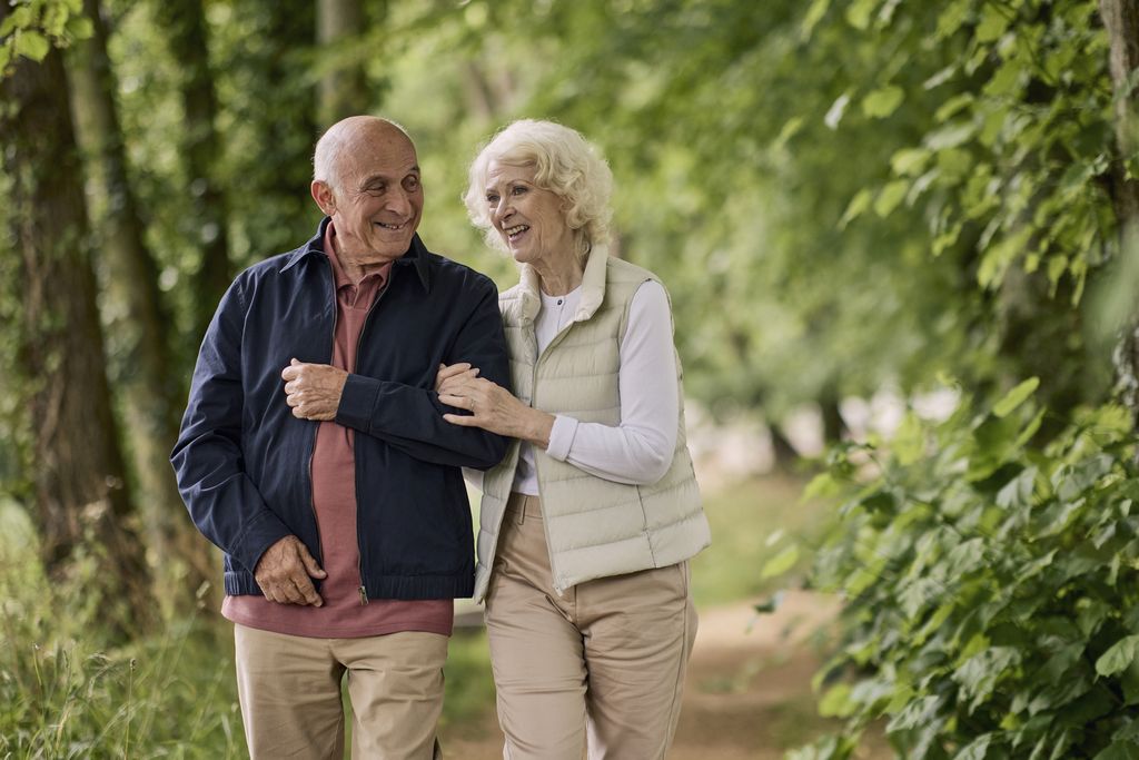 Property photo 3 of 12 A Man And Woman Standing Next To Each Other And Smiling