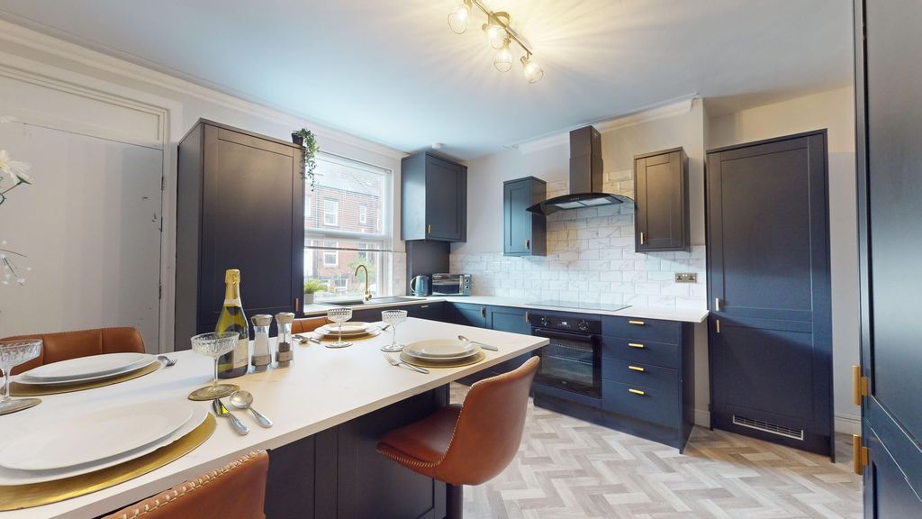 Property photo 1 of 12 This Modern Kitchen Boasts Sleek Cabinetry And Amp...