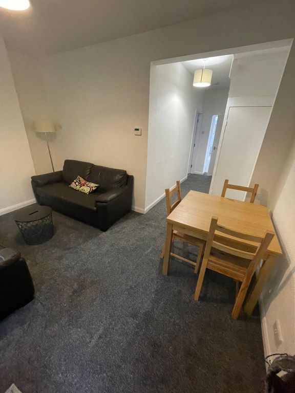 Property photo 2 of 7 A Spacious And Inviting Living Room Perfect For So...