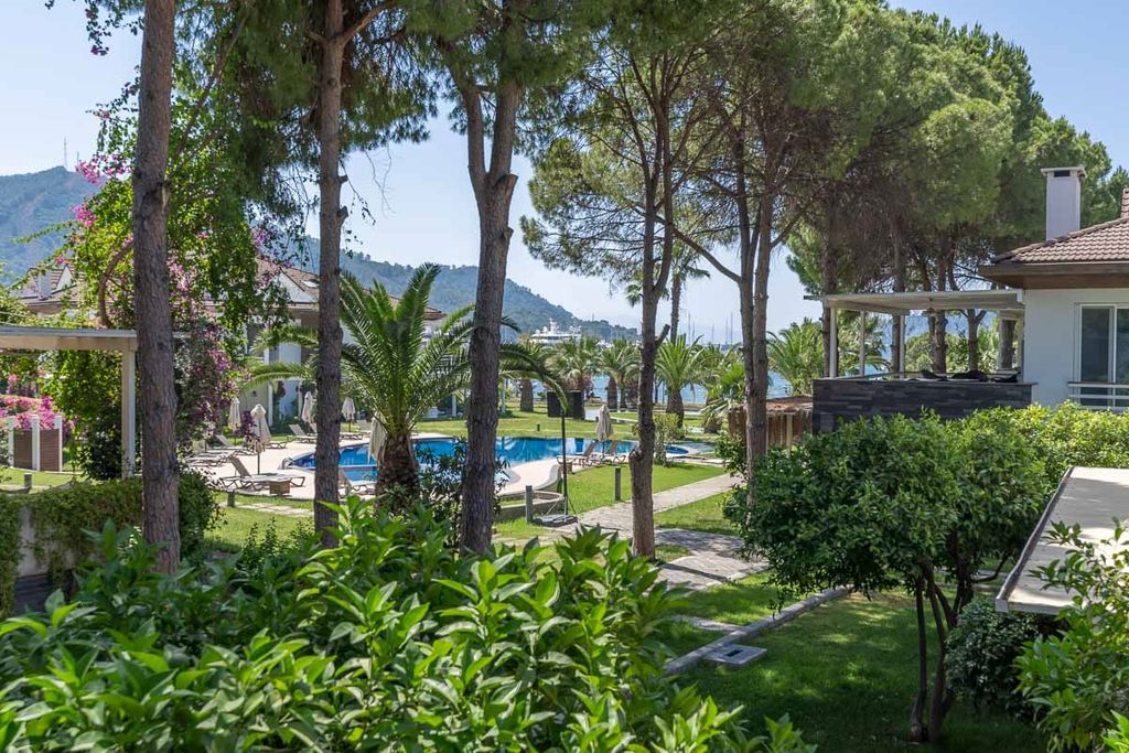 Property photo 2 of 19 A Seafront Duplex Apartment For Sale In Fethiye - Beautiful Gardens With Partial Sea Views