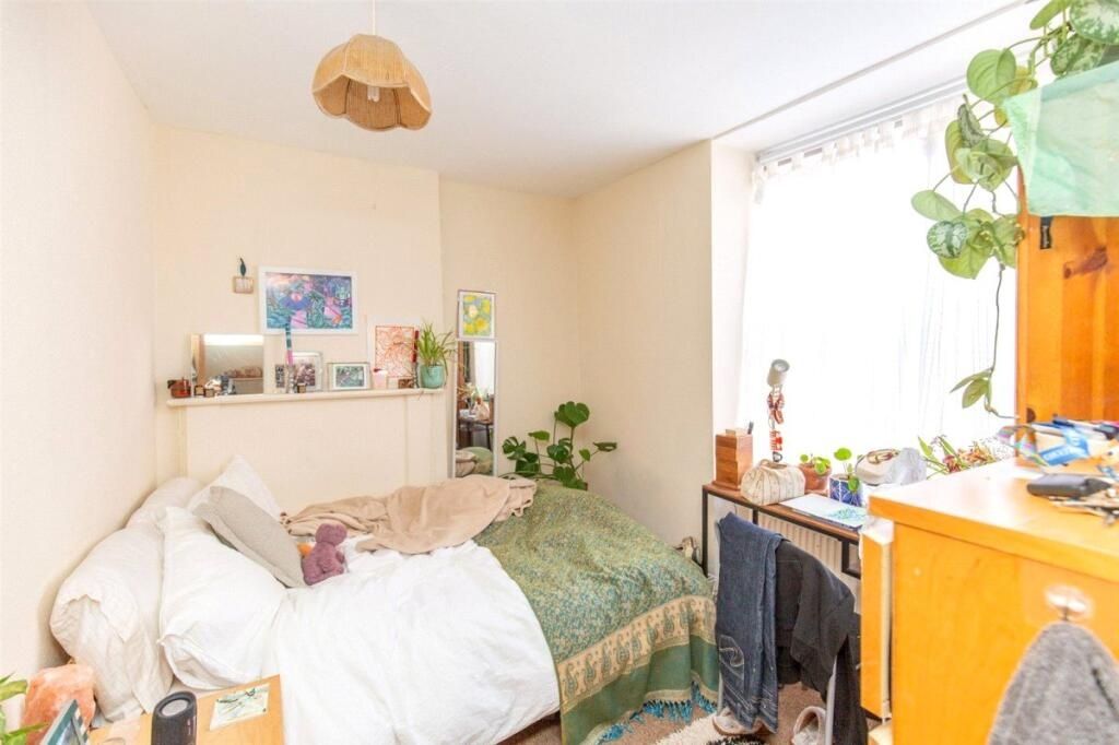 Property photo 3 of 7 A Cozy Bedroom Featuring A Comfortable Bed, A Wind...