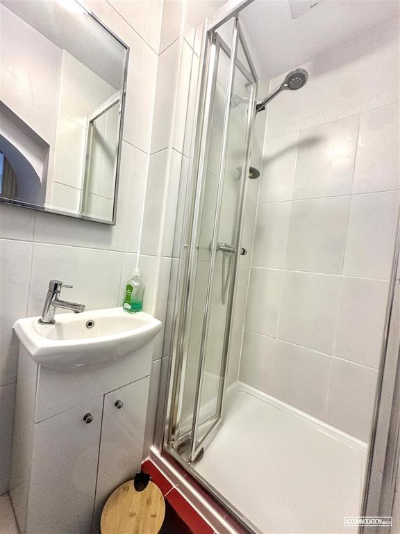 Property photo 3 of 16 Bright And Modern Shower Room With Tiled Walls...