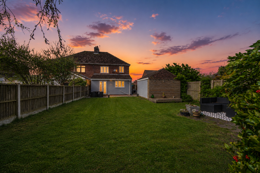Property photo 3 of 25 Nighttime Shot Rear Elevation