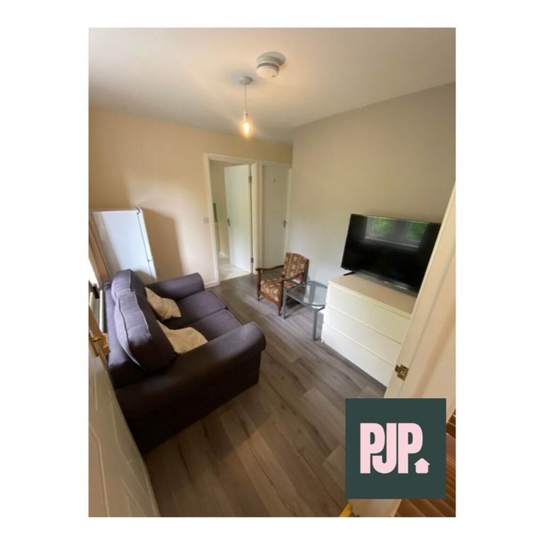 Property photo 3 of 6 Cozy Living Room With A Stylish Sofa And Modern TV...