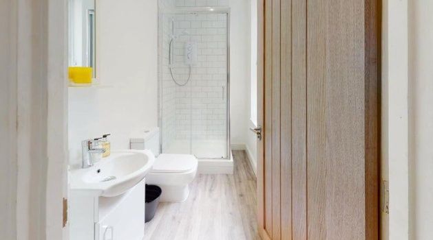 Property photo 2 of 8 A Modern, Pristine Bathroom Featuring A Walk-In Sh...