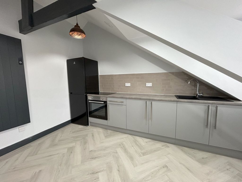 Property photo 1 of 9 A Modern Kitchen With Sleek Grey Cabinets, Built-i...