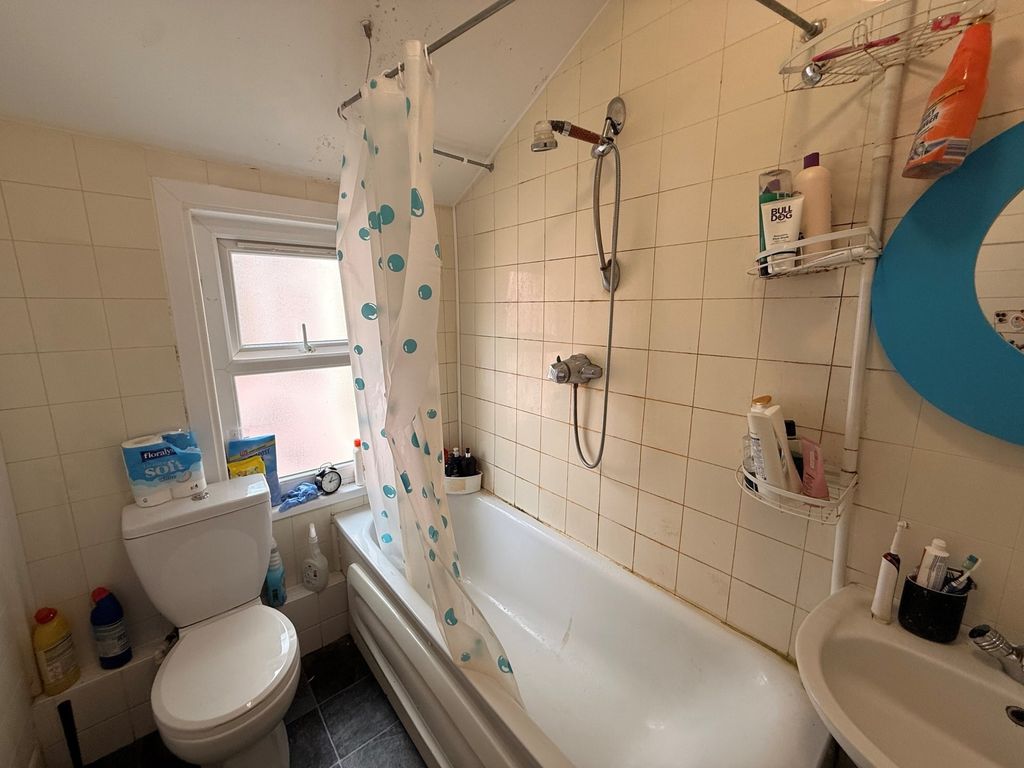Property photo 1 of 10 Compact Bathroom With A Shower-Over-Bath, Patterne...