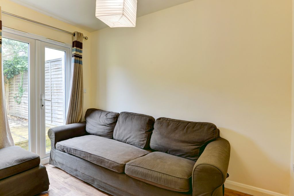 Property photo 2 of 11 A Bright And Welcoming Living Room Featuring A Com...