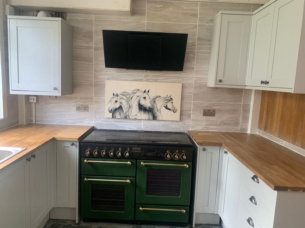 Property photo 3 of 11 A Stylish Kitchen Featuring A Classic Green Oven W...