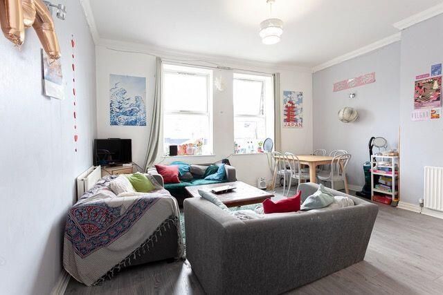 Property photo 2 of 15 Bright And Inviting Living Room With Large Windows...