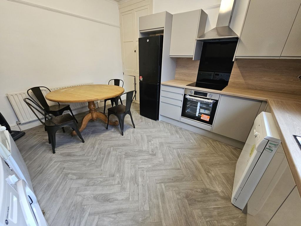 Property photo 3 of 11 A Modern Kitchen With Ample Workspace, Integrated ...