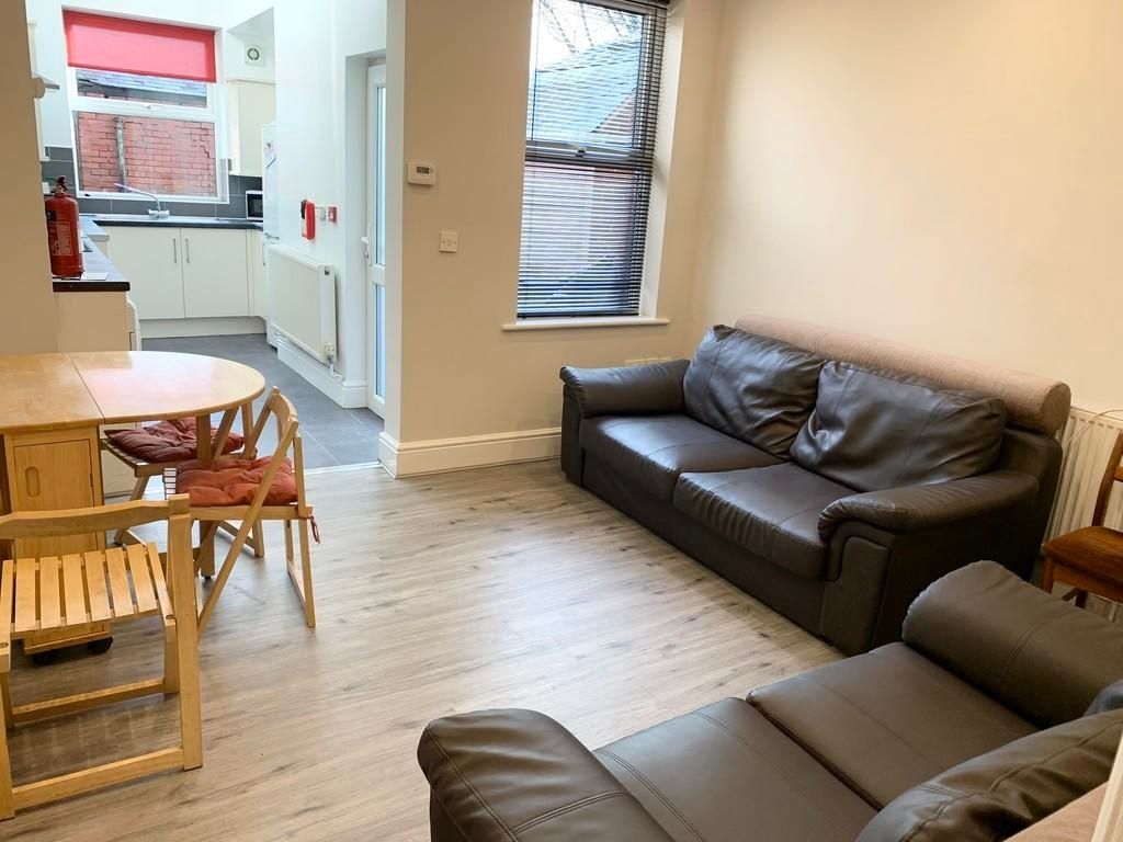 Property photo 2 of 10 Bright And Welcoming Living Room Featuring Comfort...