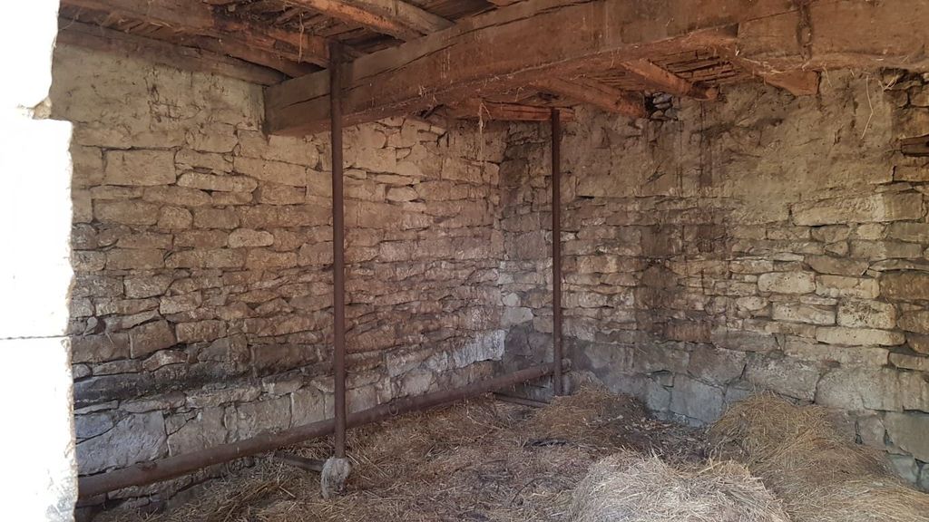 Property photo 3 of 50 Inside View Of A Stone Outbuilding Showing Wooden Ceiling Beams And Metal Poles Supporting The Structure, With Straw Covering The Floor.