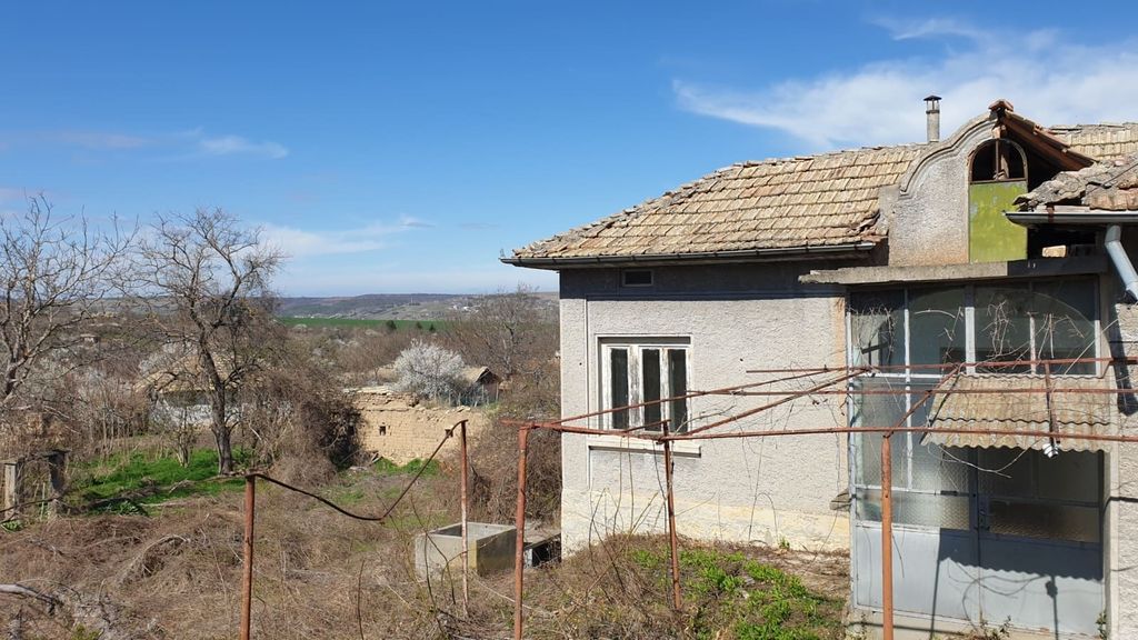 Property photo 3 of 33 View Of A Village House With A Tiled Roof And Enclosed Porch, Overlooking A Garden Area With Both Dry And Green Vegetation Patches.