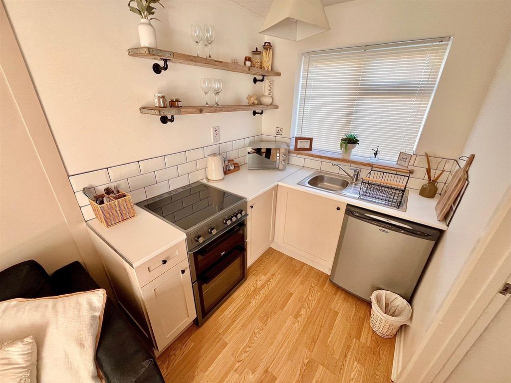 Property photo 3 of 9 Kitchen Area