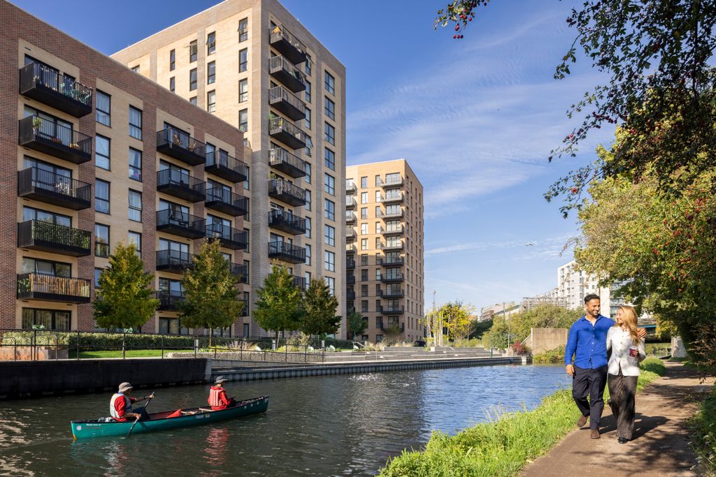 Property photo 2 of 6 Two People Walking Down The Canal With Their Arms Around Each Other And Two People In A Canoe On The
