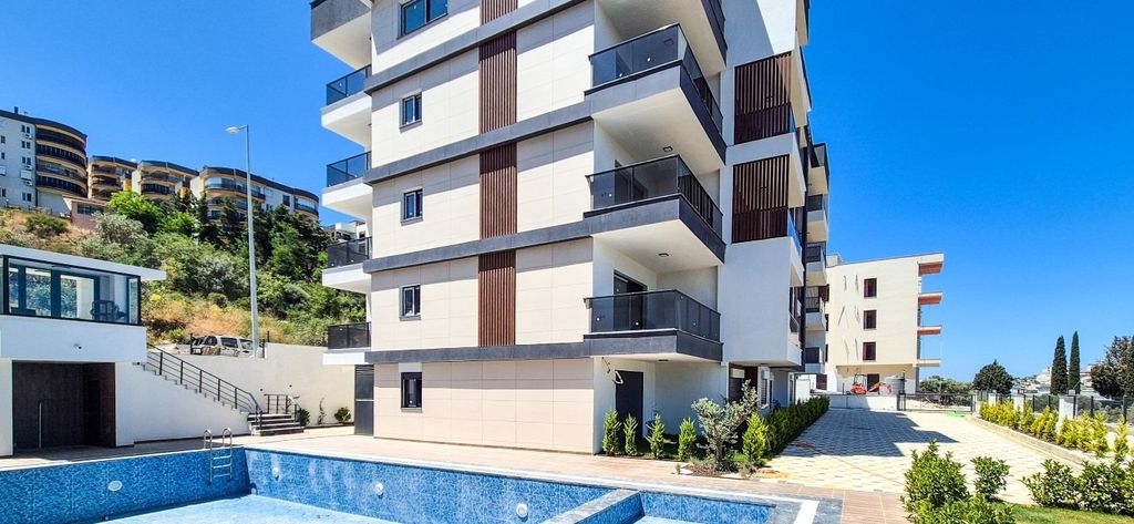 Property photo 1 of 19 Newly Built Apartments In Kusadasi With A Shared Pool For Sale - A Modern Apartment Complex