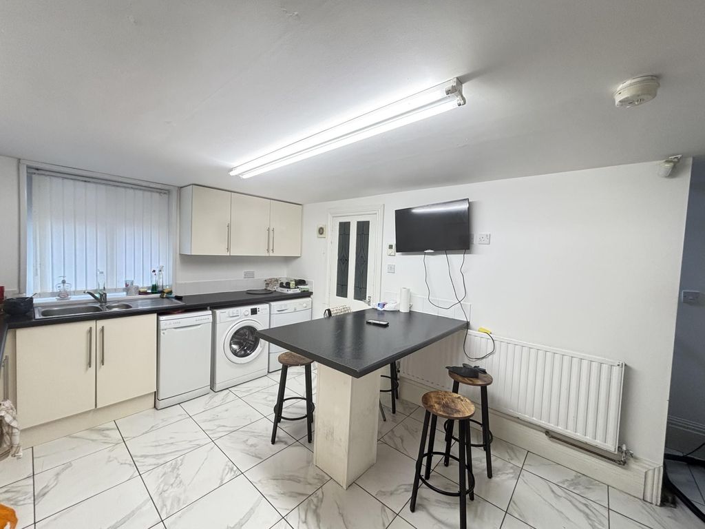 Property photo 3 of 6 Bright And Functional Kitchen Space Featuring Ampl...