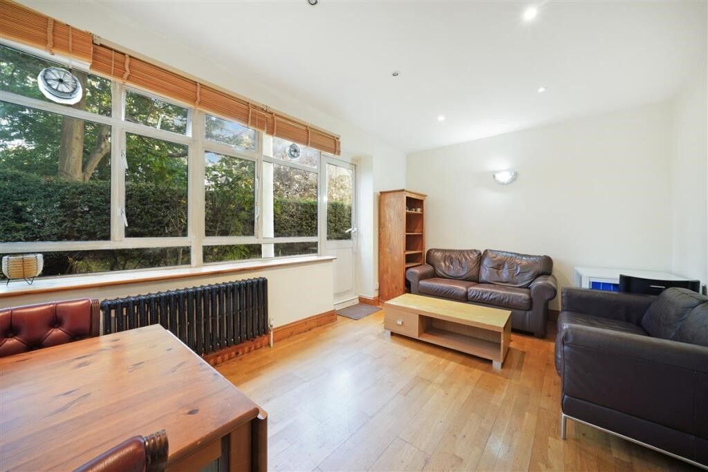 Property photo 2 of 12 Bright Lounge With Large Windows And Wood Floors...