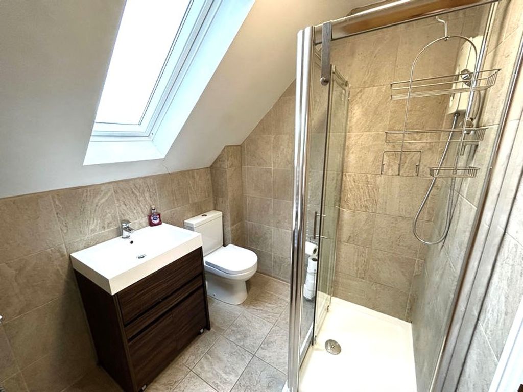 Property photo 1 of 8 A Modern And Clean Bathroom Featuring A Stylish Sh...