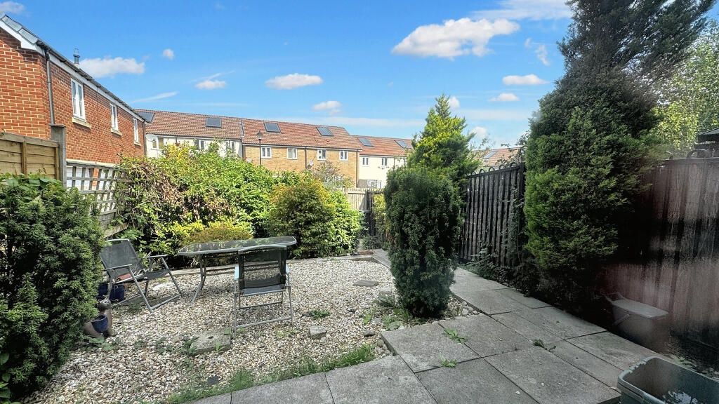 Property photo 1 of 9 A Charming Garden Area Featuring A Paved Patio And...