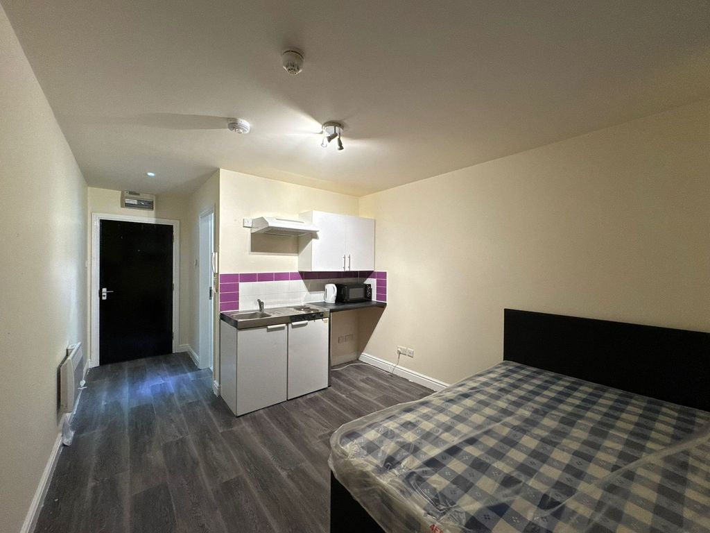 Property photo 1 of 2 A Well-Lit, Modern Living Area Featuring A Comfort...