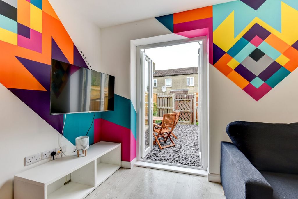 Property photo 3 of 5 Bright Contemporary Living Area With Bold Geometri...