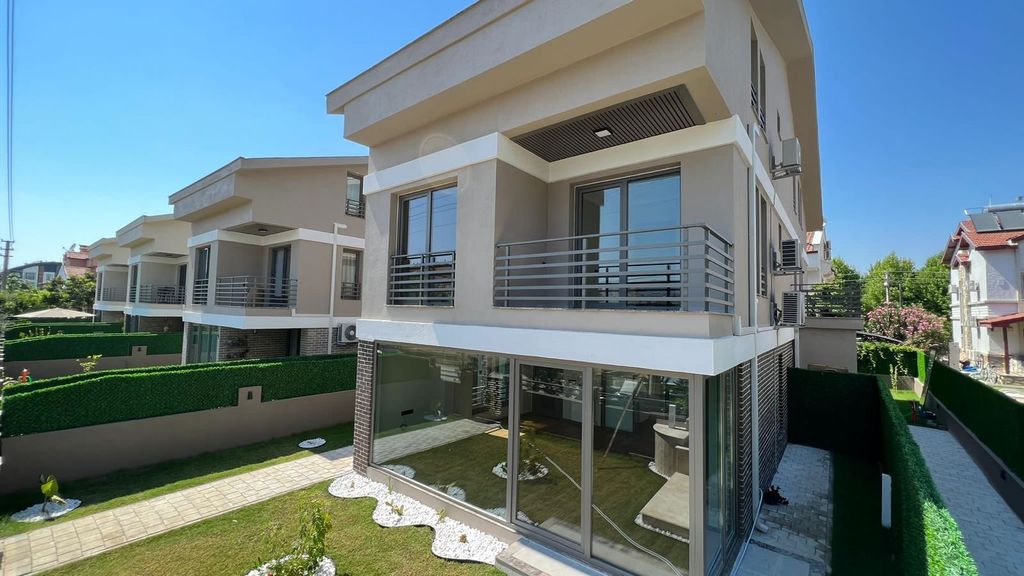 Property photo 1 of 21 A Spacious Semi-Detached Triplex Villa For Sale In Fethiye - Main View Of The Triplex Villa And Private Garden