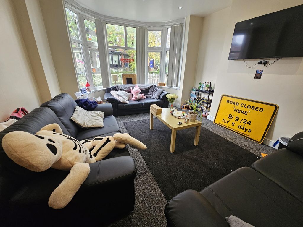 Property photo 3 of 29 Bright And Welcoming Living Room Featuring Comfort...