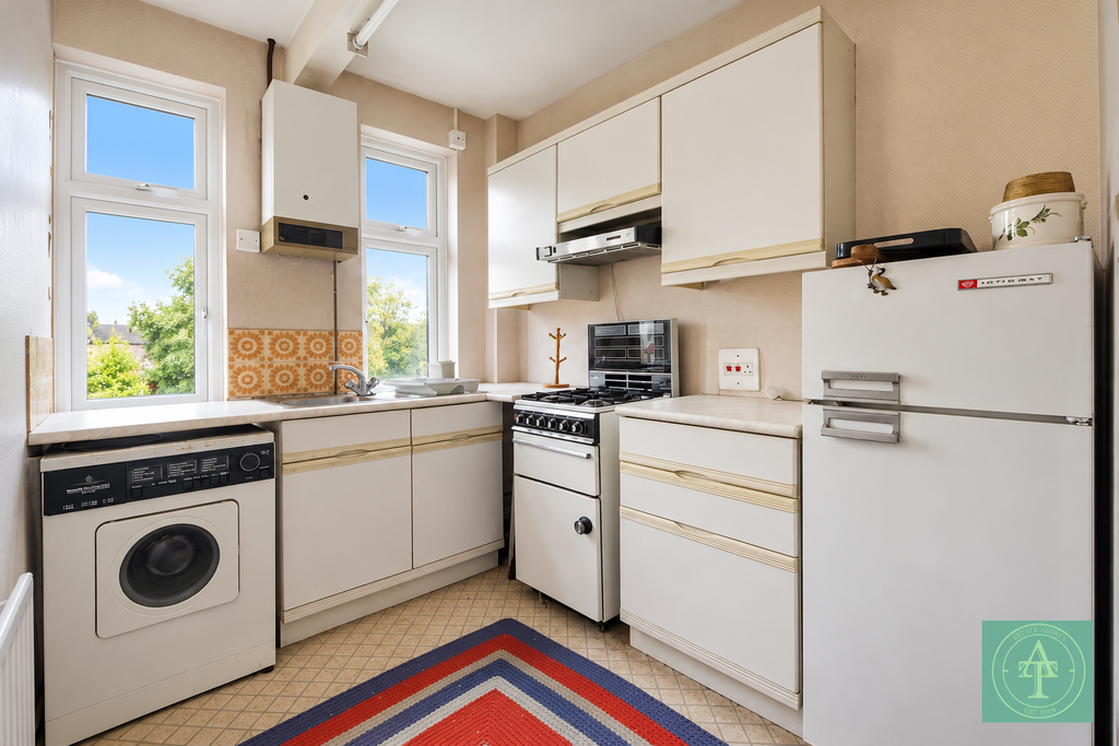 Property photo 3 of 8 Bright Retro Kitchen With Colourful Rug