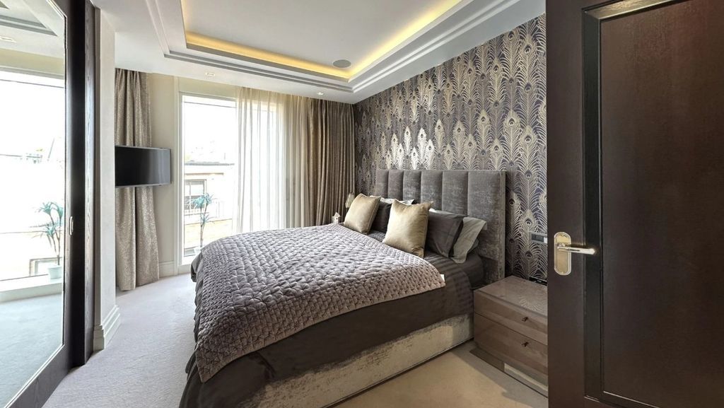 Property photo 1 of 24 A Stylish Master Bedroom Featuring A Plush Double ...