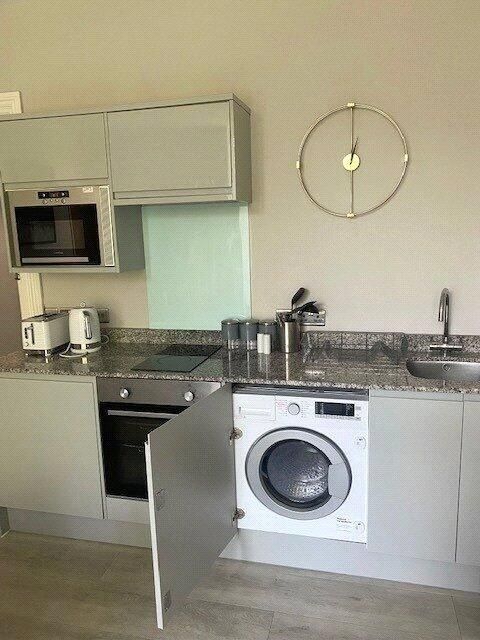 Property photo 2 of 5 Modern Kitchen Area Featuring Integrated Appliance...