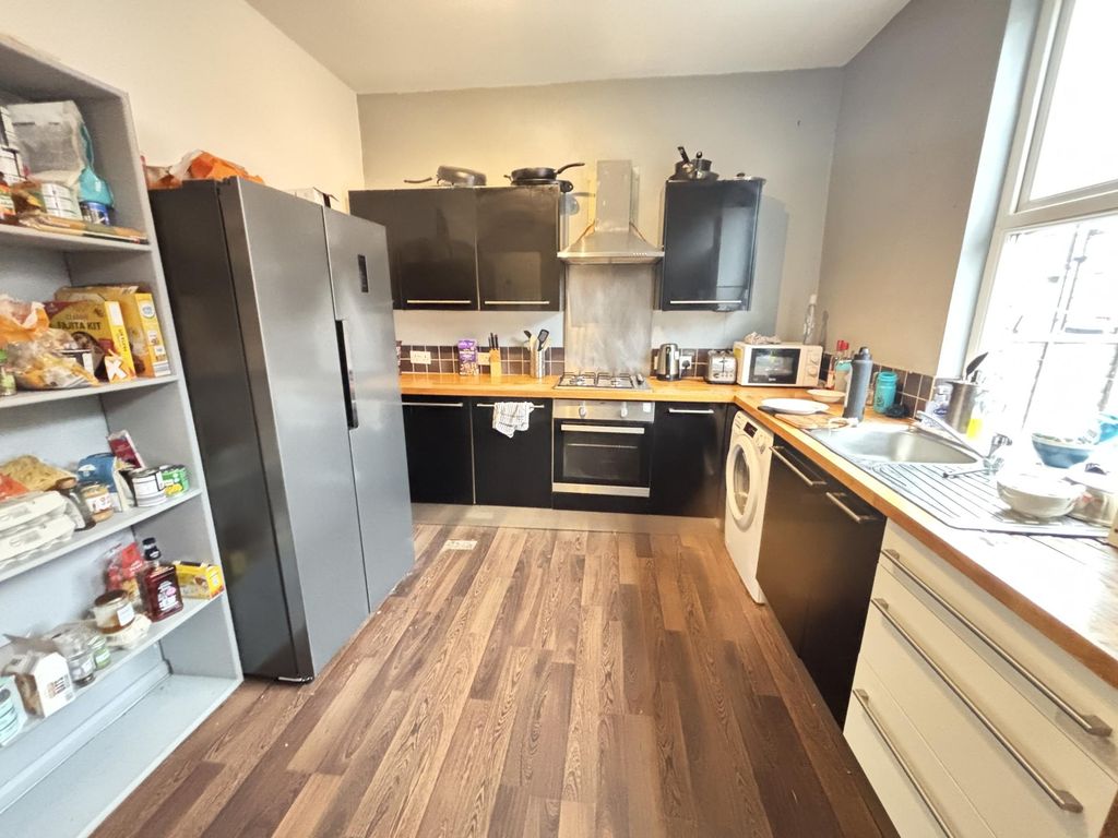 Property photo 1 of 24 Bright And Modern Kitchen Area Featuring Ample Nat...
