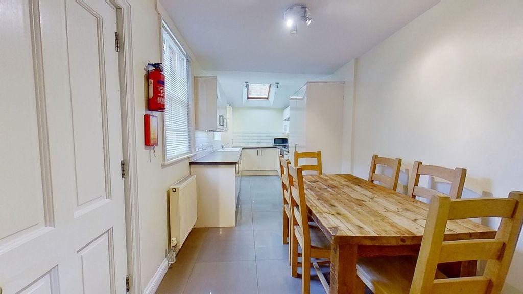Property photo 1 of 9 Bright Combined Kitchen And Dining Area With A Rus...