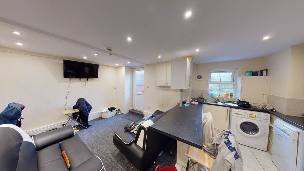 Property photo 1 of 6 Bright And Spacious Living Room Featuring Modern F...