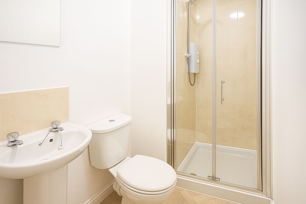 Property photo 3 of 9 Bright, Modern Bathroom With A Clean White Sink An...