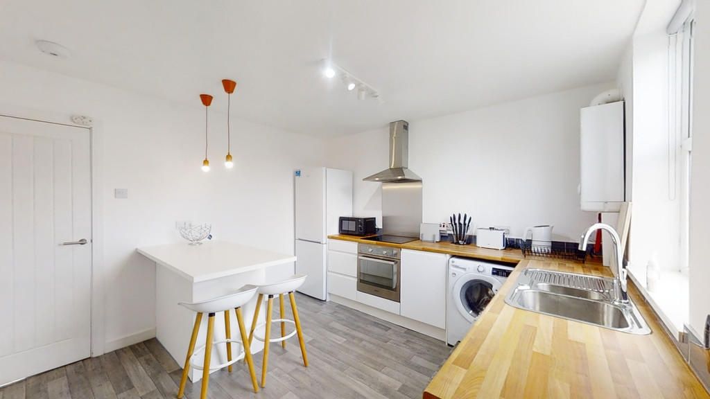 Property photo 1 of 10 A Bright And Modern Kitchen Featuring Clean White ...