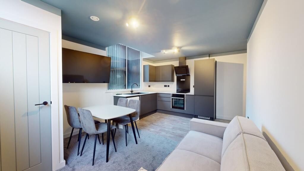 Property photo 3 of 11 A Modern And Inviting Kitchenette With Sleek Appli...
