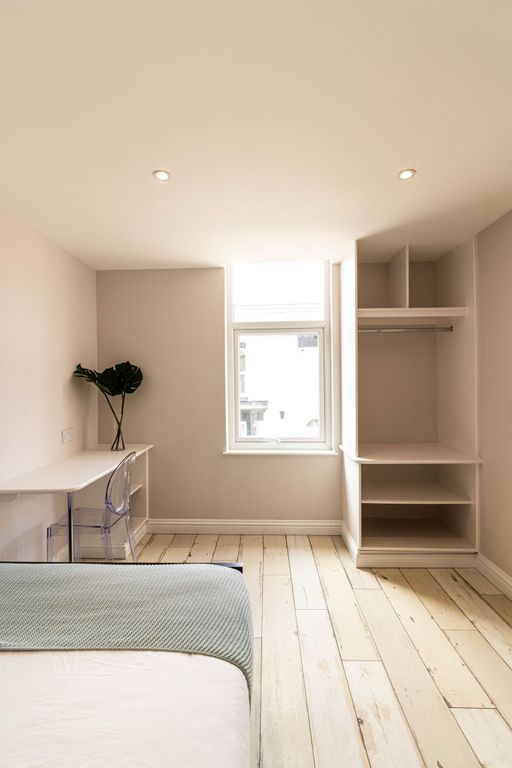 Property photo 2 of 7 Bright And Airy Double Bedroom Featuring A Large W...