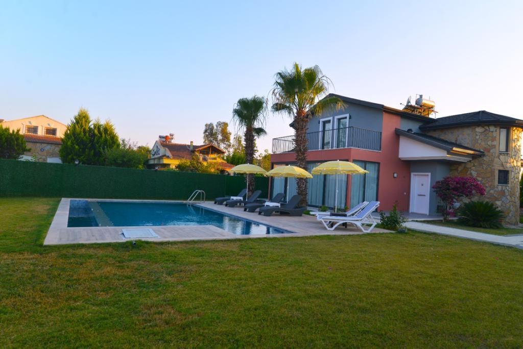 Property photo 3 of 19 An Immaculate Fethiye Investment Property For Sale - Vast Private Garden And Sun Terrace Surrounding The Large Private Pool