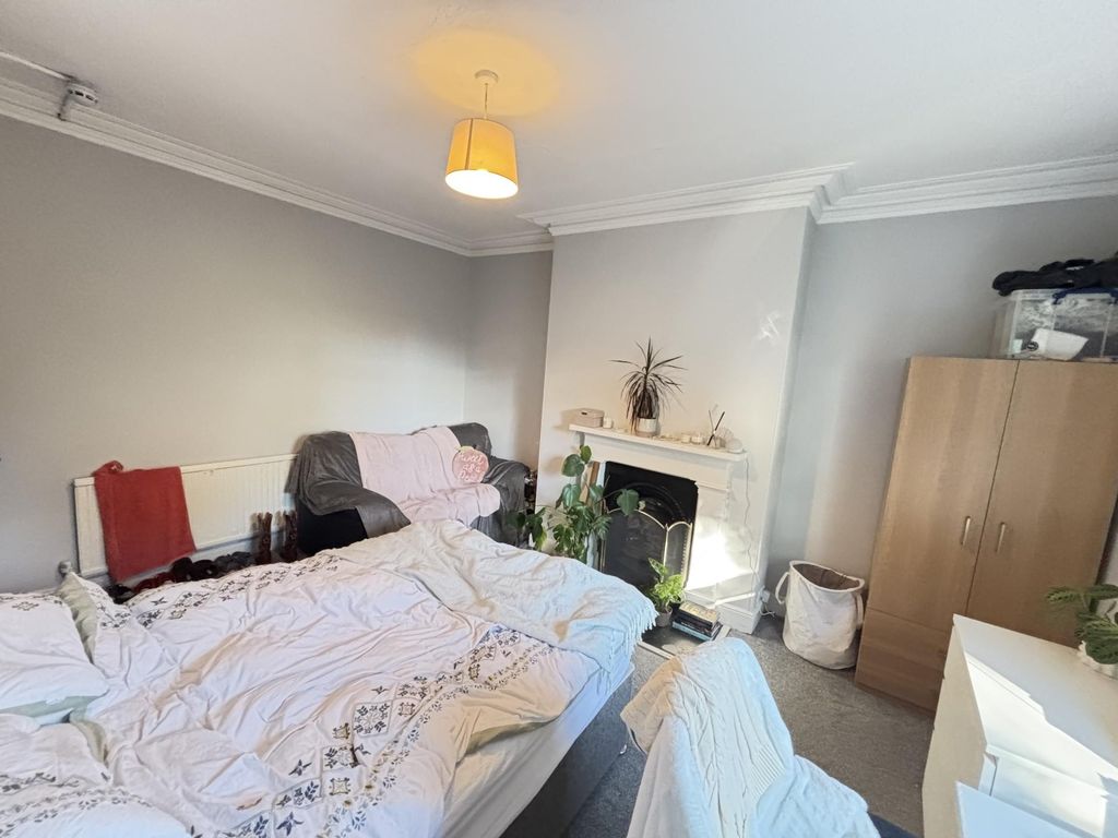 Property photo 3 of 94 A Well-Lit And Inviting Living Room Featuring A Co...